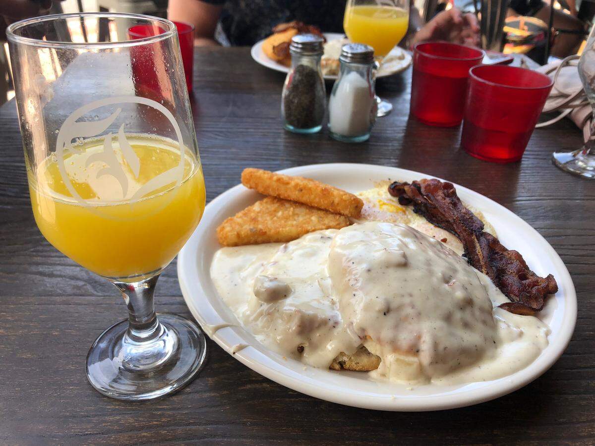 Biscuits and gravy are served with eggs, bacon and hash browns at Libertine Brewing Co. in San Luis Obispo.