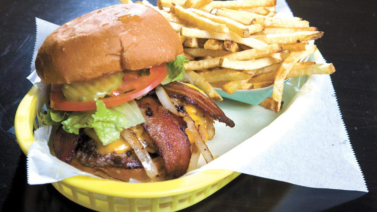 The Wee Shack Burger Café in Morro Bay features the Wee-Man burger with jalapeño-flavored bacon and sauteed onions, served here with hand-cut fries.