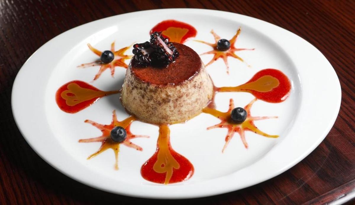 Homemade flan is served with seasonal fruit at Blue Moon Southwestern Grill in Paso Robles.