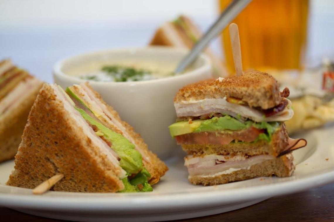 A club sandwich with ham, turkey, bacon, provolone cheese and avocado is among the options at Bayside Café in Morro Bay.