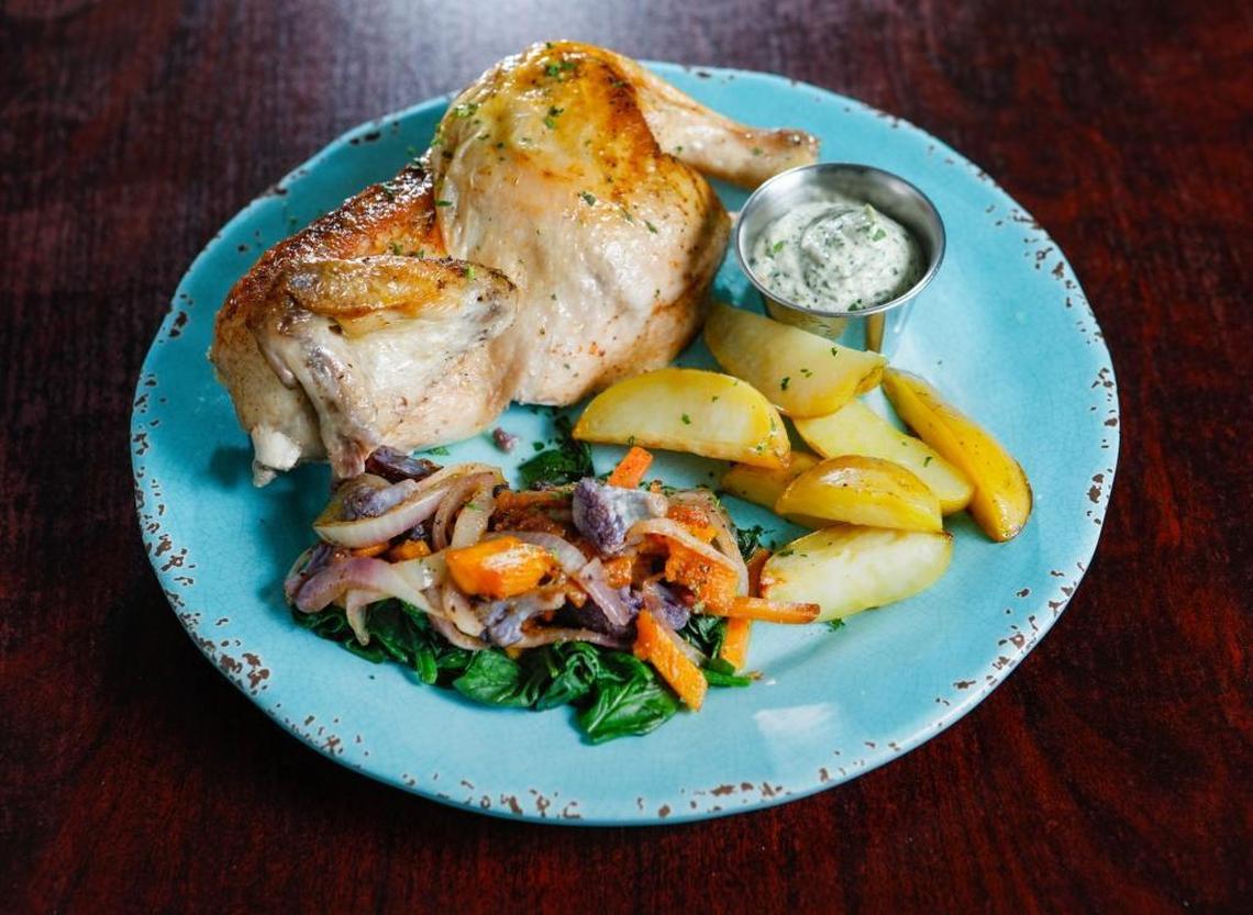 A rotisserie chicken dinner comes with roasted vegetables and potatoes at Fig Good Food at Courtney’s House in Templeton.