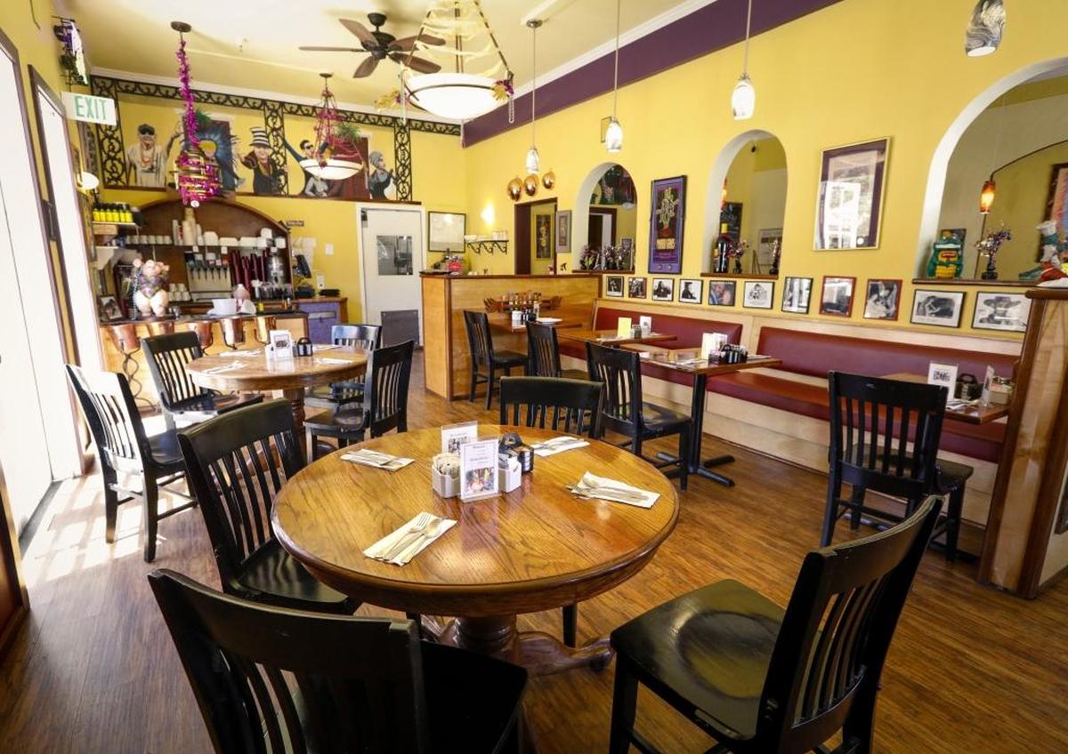 Bon Temps Creole Café in San Luis Obispo features a festive interior with high ceilings and Mardi Gras-inspired décor.