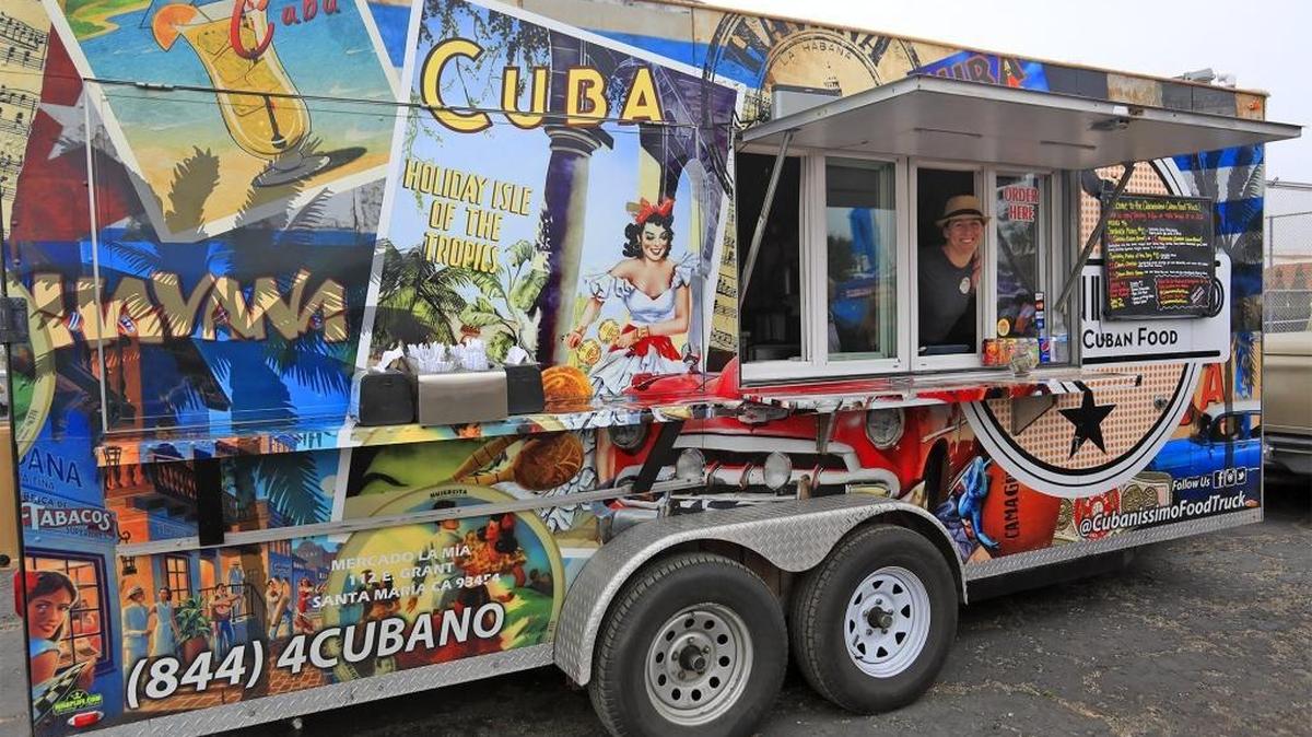 Cubanissimo co-owner Chrystal Trenado prepares to greet customers May 5 at Cuesta College in San Luis Obispo. She runs the food truck with her husband and business partner, Arqui.