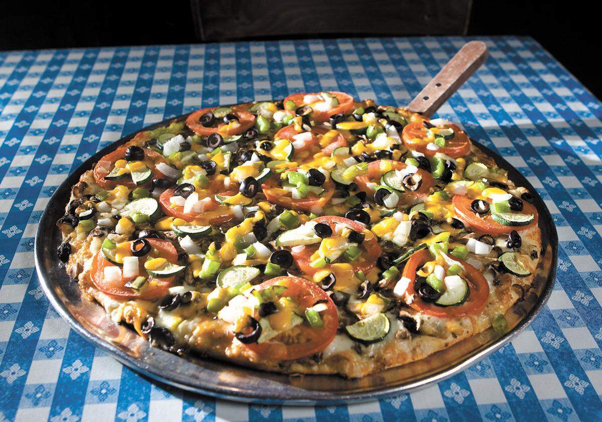 The veggie pizza at Klondike Pizza, which has locations in Arroyo Grande and Santa Maria, has mushrooms, zucchini, black olives, tomatoes, bell peppers and onions with optional garlic sauce.
