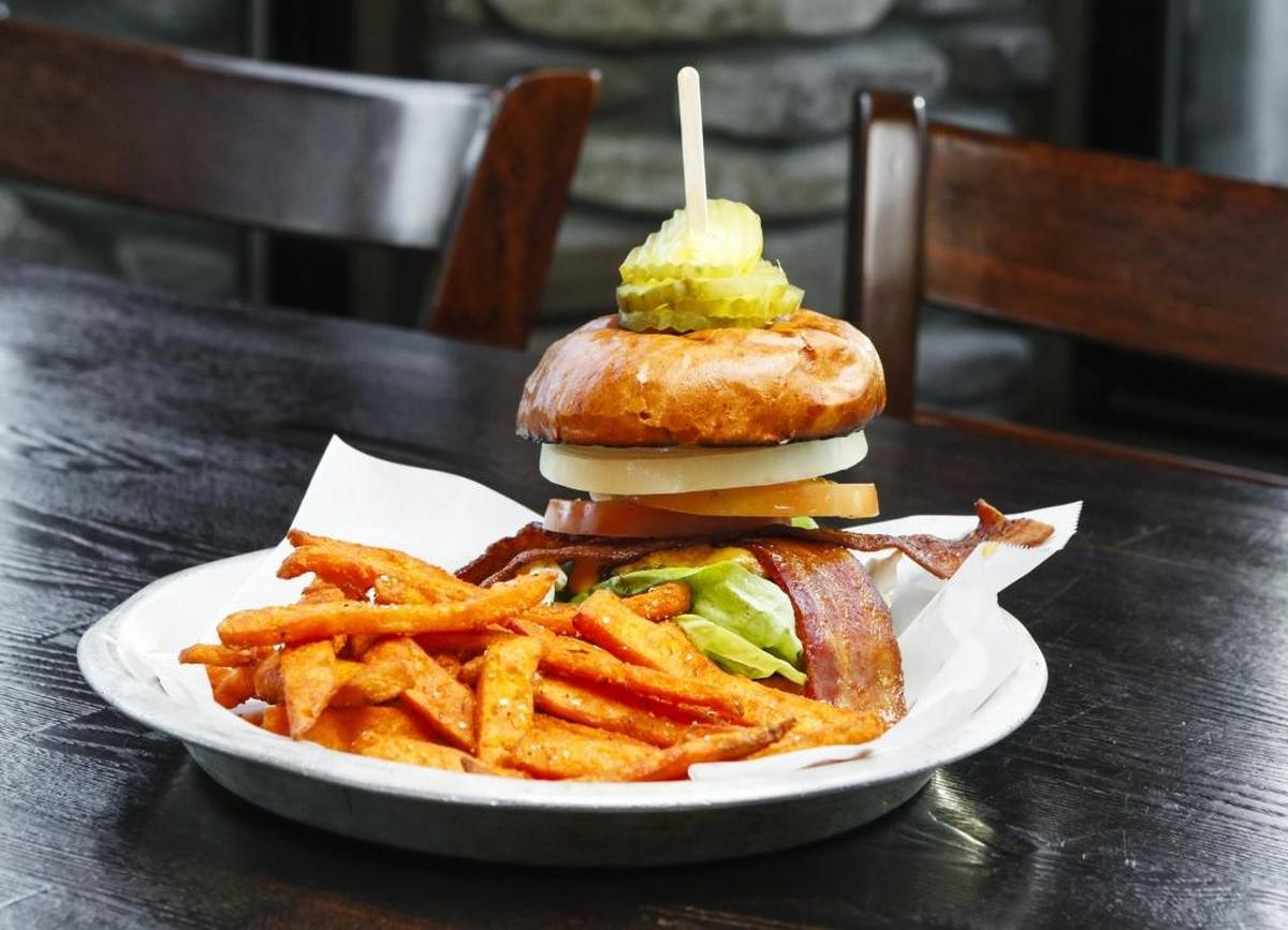 Shell Beach Brewhouse’s Standard burger pairs a half-pound beef patty with aged cheddar, slab bacon, dill pickles, butter lettuce, tomato, sweet onion and ale burger sauce on a brioche bun. It’s served with sweet potato fries.