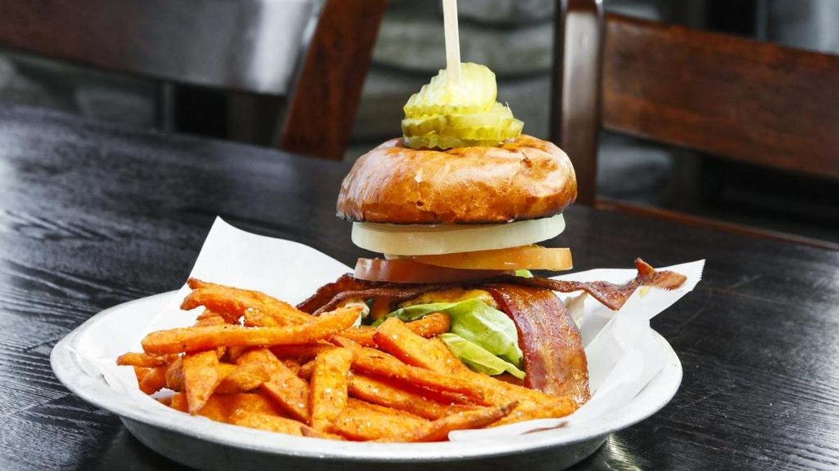 Shell Beach Brewhouse’s Standard burger pairs a half-pound beef patty with aged cheddar, slab bacon, dill pickles, butter lettuce, tomato, sweet onion and ale burger sauce on a brioche bun. It’s served with sweet potato fries.
