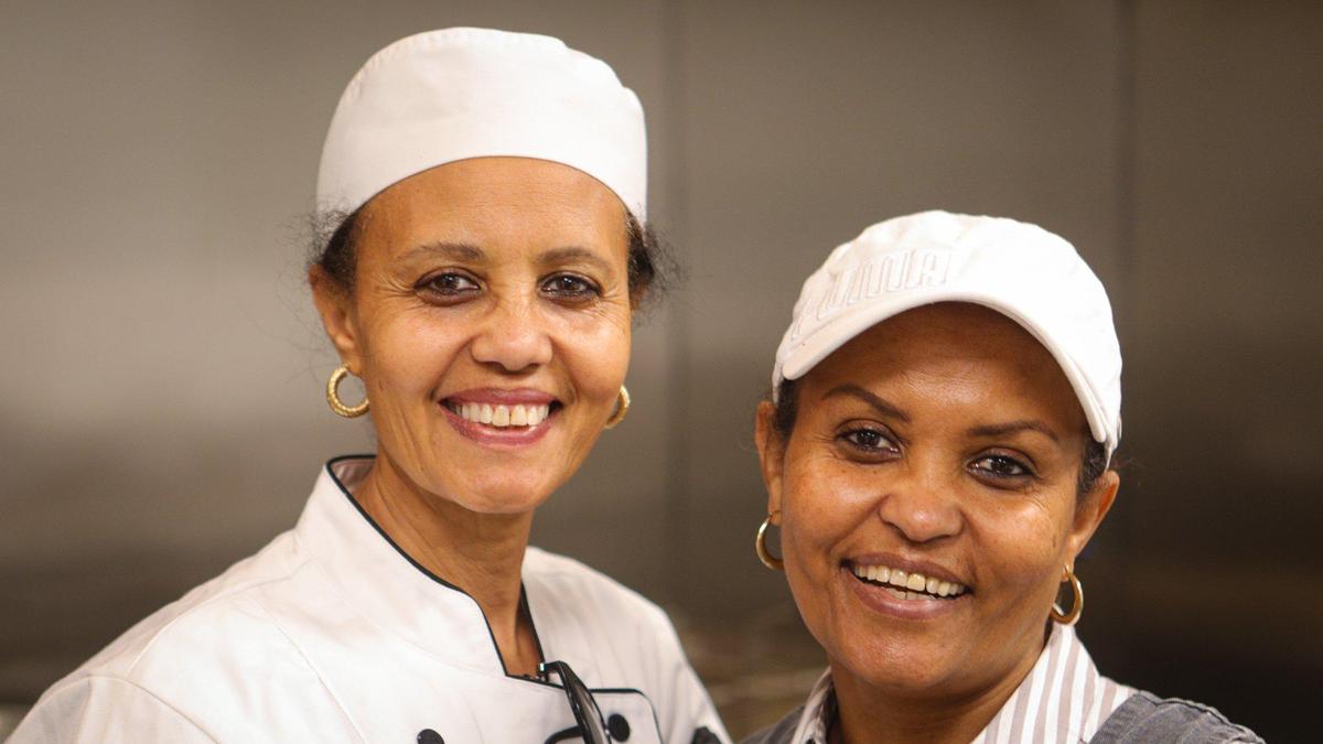 Chef Helen Abraha, left, and Martha Taezaz cook the food at Ebony, a new Ethiopian restaurant in San Luis Obispo, which operates out of The Kitchen Terminal (a commercial kitchen space near the airport) April 28, 2022. They have other two partners as well.