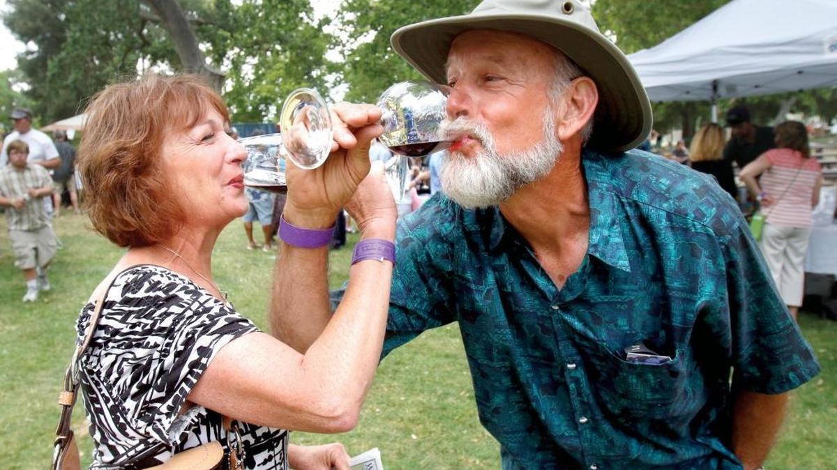 Michelle Bissonnette and Bryan Bock of Santa Margarita enjoy a sip of wine at the Atascadero Lakeside Wine Festival in 2015.