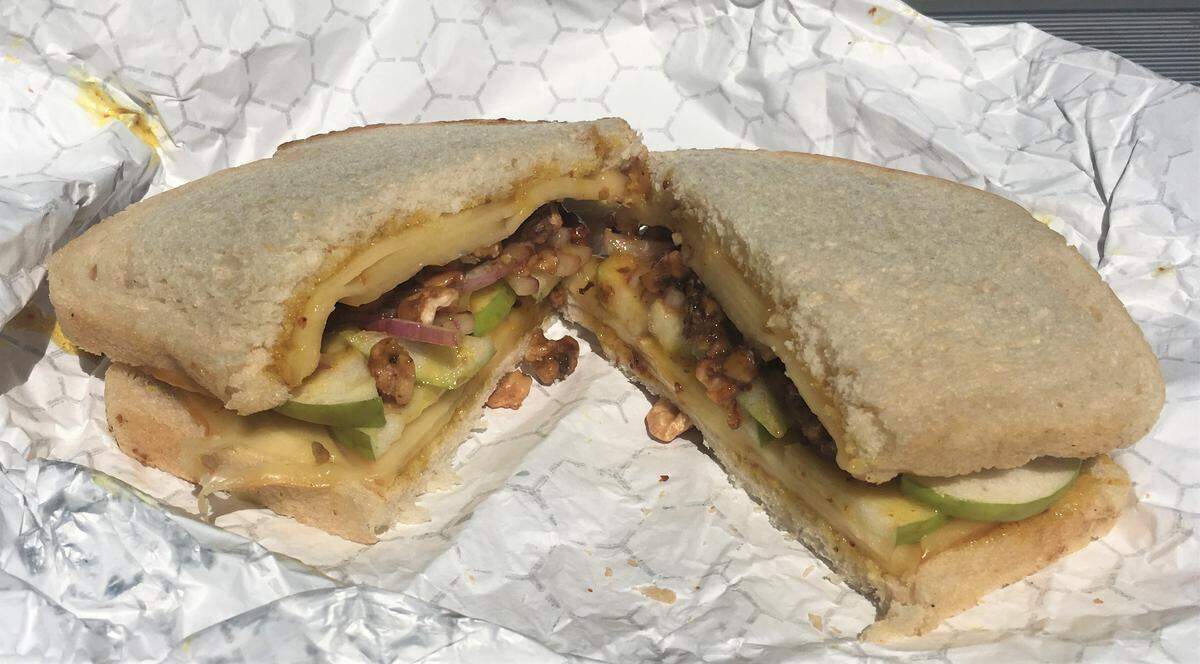 The Sweet Cheese sandwich at Red Scooter Deli in Paso Robles comes with your choice of walnuts or Black Forest ham, plus smoked gouda, caramelized onions, sliced green apples and honey mustard, on sourdough bread