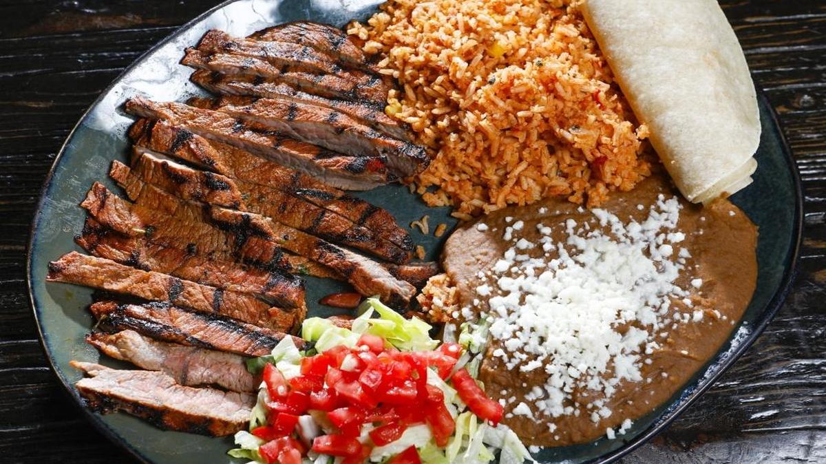 The carne asada plate at Villa Cantina in Arroyo Grande comes with refried beans and Spanish rice.