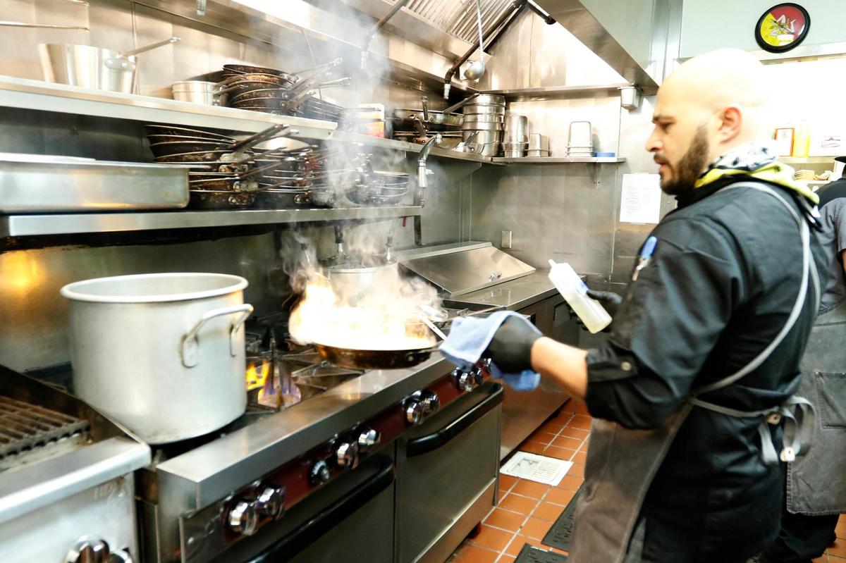 One of the owners, Chef Donato Ricci, works in the kitchen.