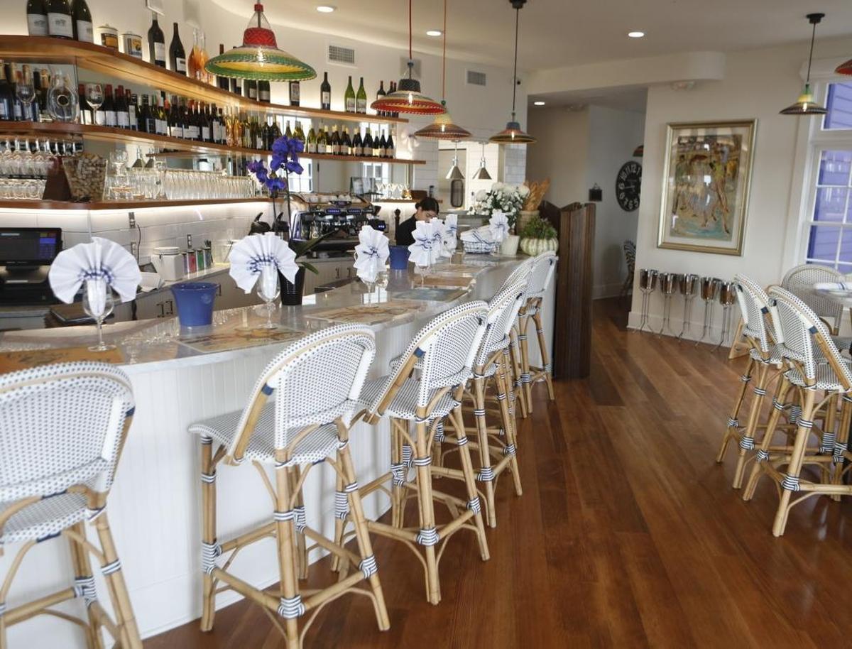 Blue Moon Over Avila in Avila Beach features soft nautical colors and high-end finishes such as marble tabletops, rattan chairs and colorful lighting fixtures.