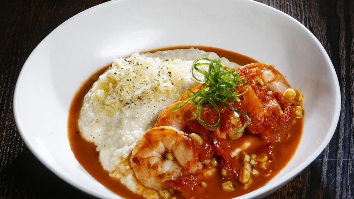 Shrimp and grits are served with tomato, fire-roasted corn and aged white cheddar cheese at The Hatch Rotisserie and Bar in Paso Robles.