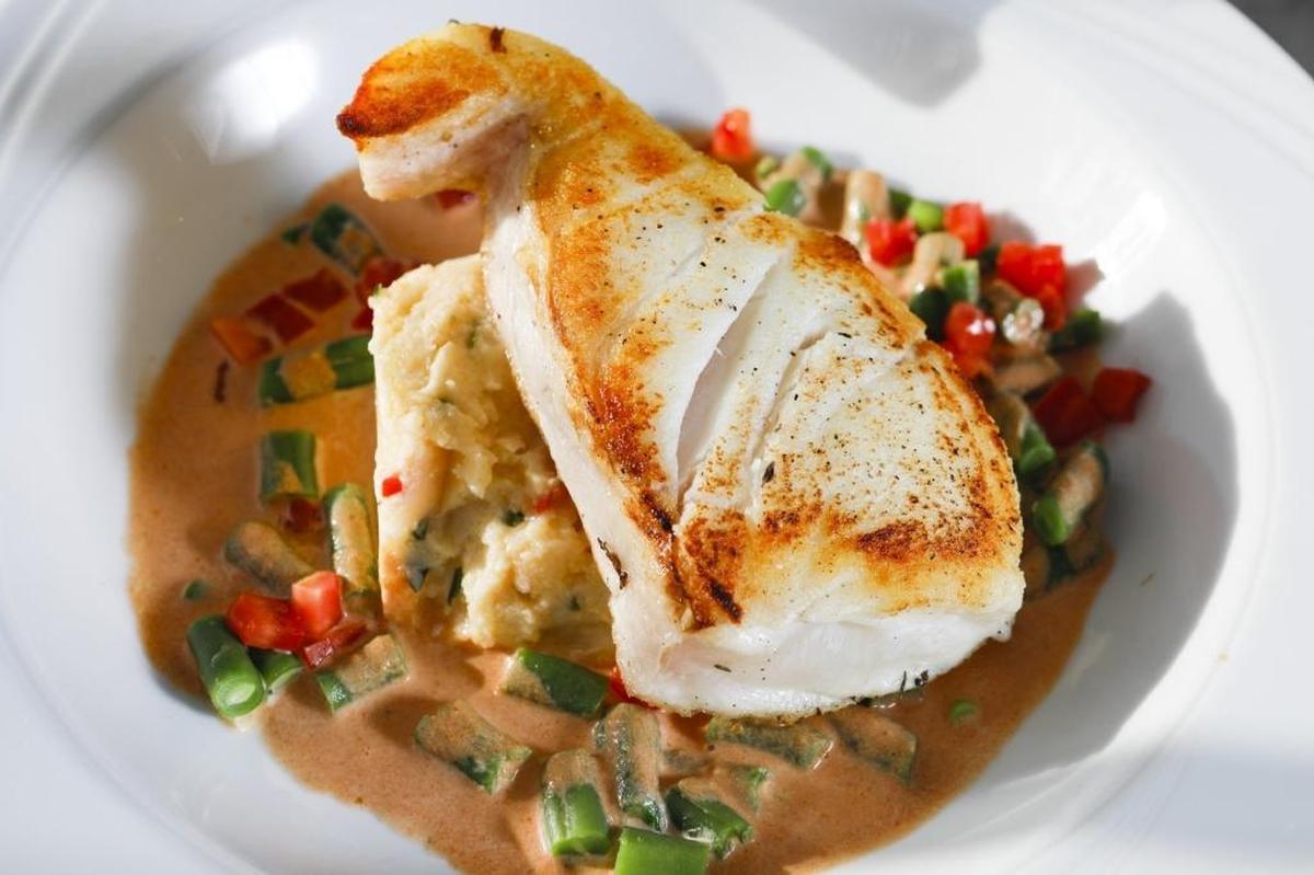 Alaskan halibut is served with herbed polenta and lobster sauce at Blue Moon Over Avila in Avila Beach.