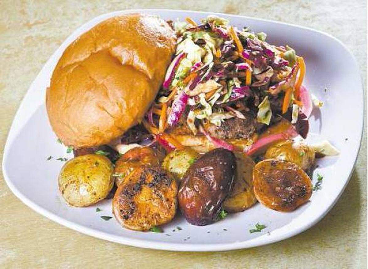 The Dragon Lady Burger comes with roasted potatoes at House of JuJu in Morro Bay..