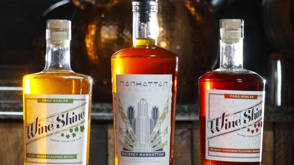 Wine Shine distillery products, from the left: Mango, ginger, black peppercorn brandy; Manhattan Project (pre-mixed Manhattan); and French oak cinnamon-flavored brandy.
