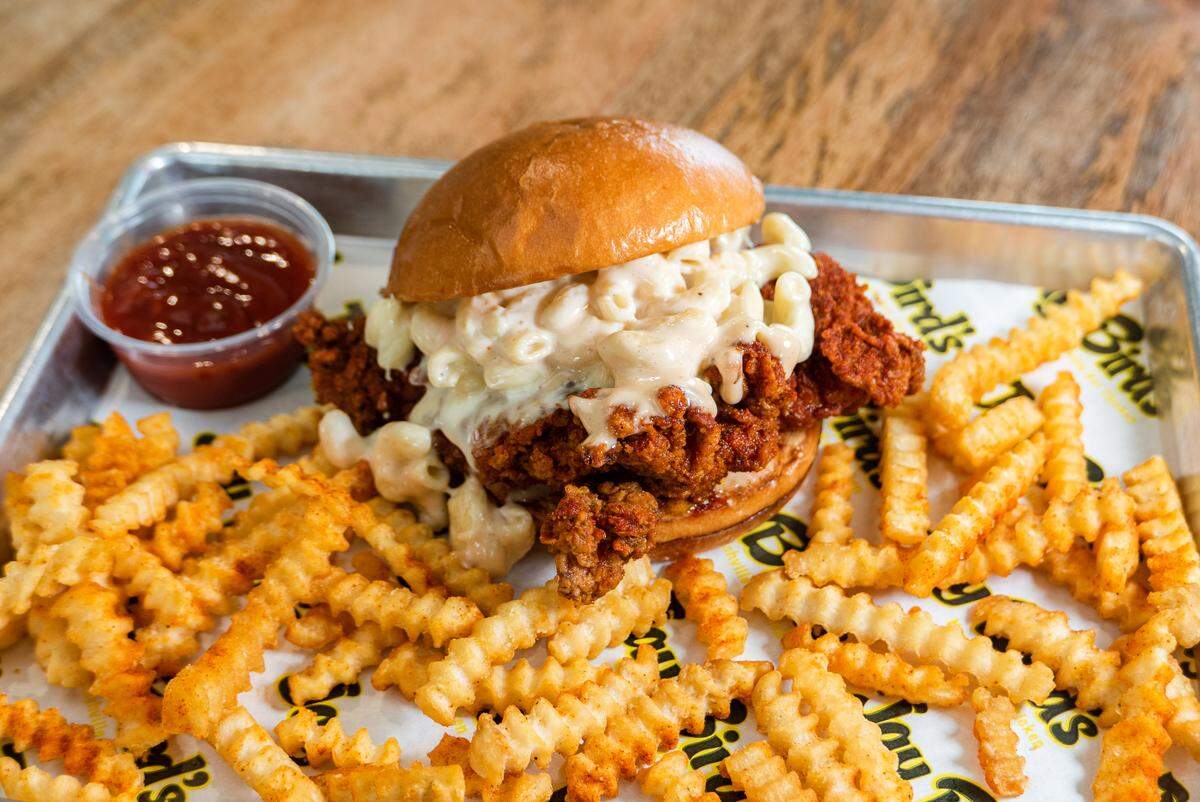 The Mac Daddy Sandwich and Fries at the new Jay Bird’s Nashville Hot Chicken in SLO is a chicken sandwich topped with mac ‘n cheese.