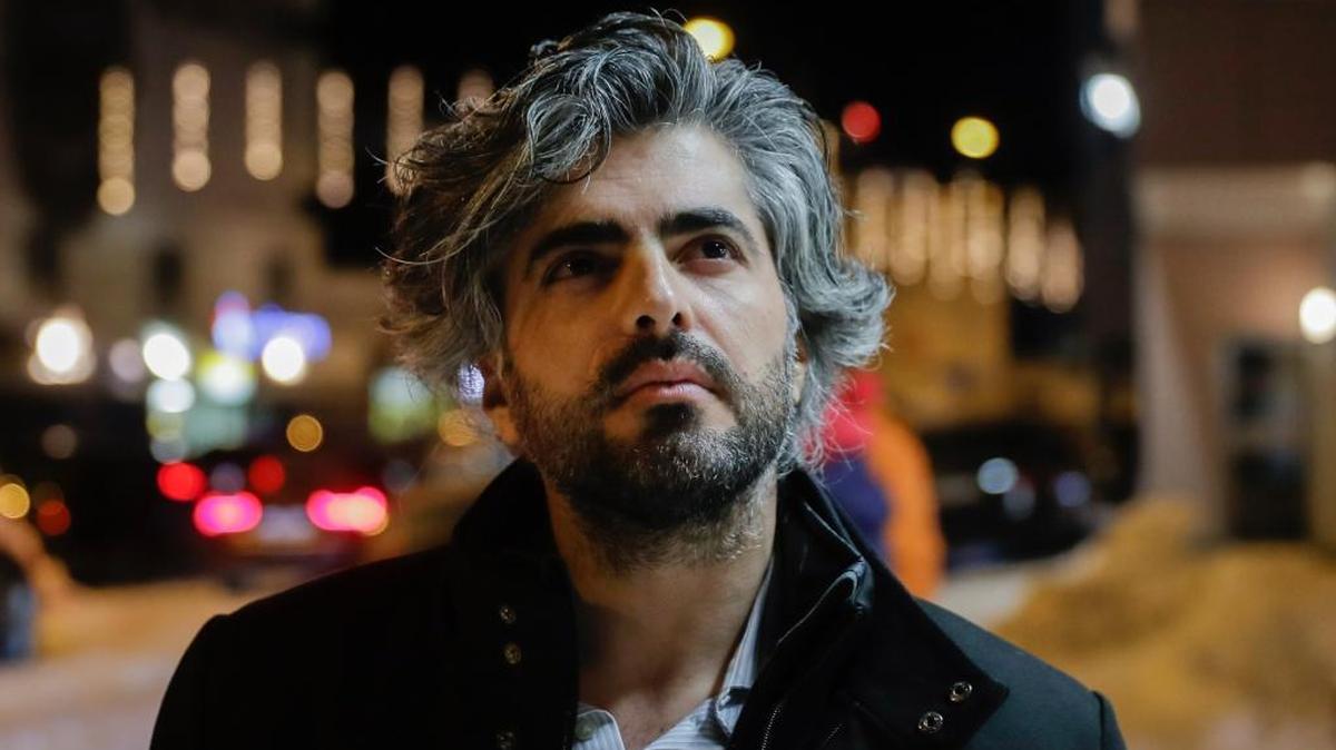Syrian director Firas Fayyad poses for a photo in Davos, Switzerland on Tuesday. His movie “Last Men in Aleppo,” nominated for best documentary feature at the 90th annual Academy Awards, will be screened at the San Luis Obispo International Film Festival in March.