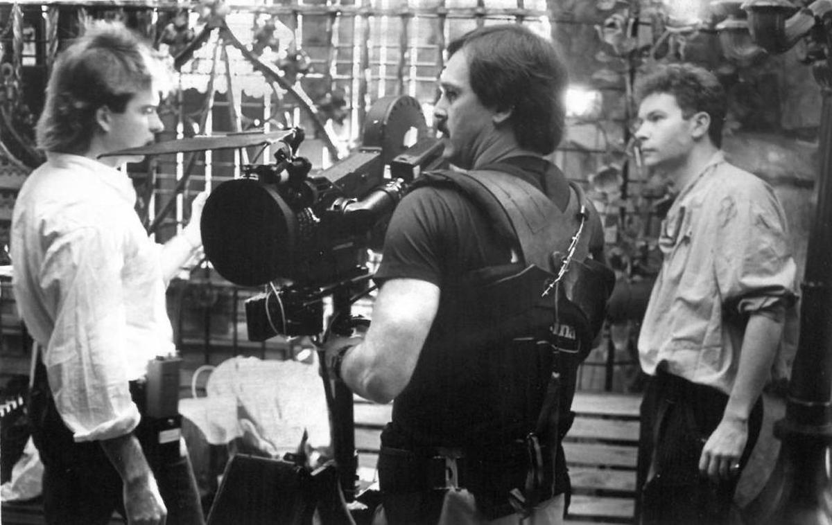 Julien Temple, right, directs cameraman Randy Noleman, center, and another crew member on the set of “Aria” in 1986.