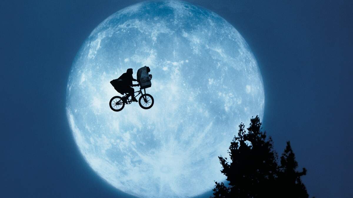 Elliott (Henry Thomas) and E.T. appear in a scene from “E.T. the Extra-Terrestrial.”