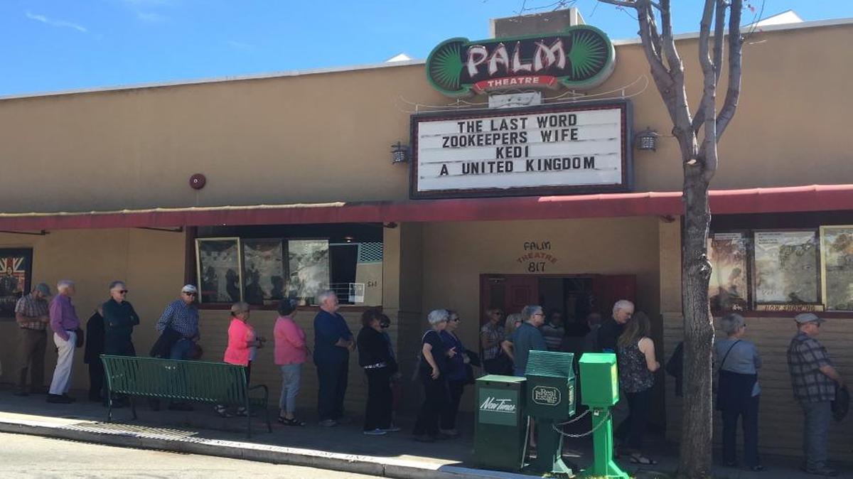 Moviegoers line up outside the Palm Theatre in downtown San Luis Obispo on Saturday, April 1, 2017.