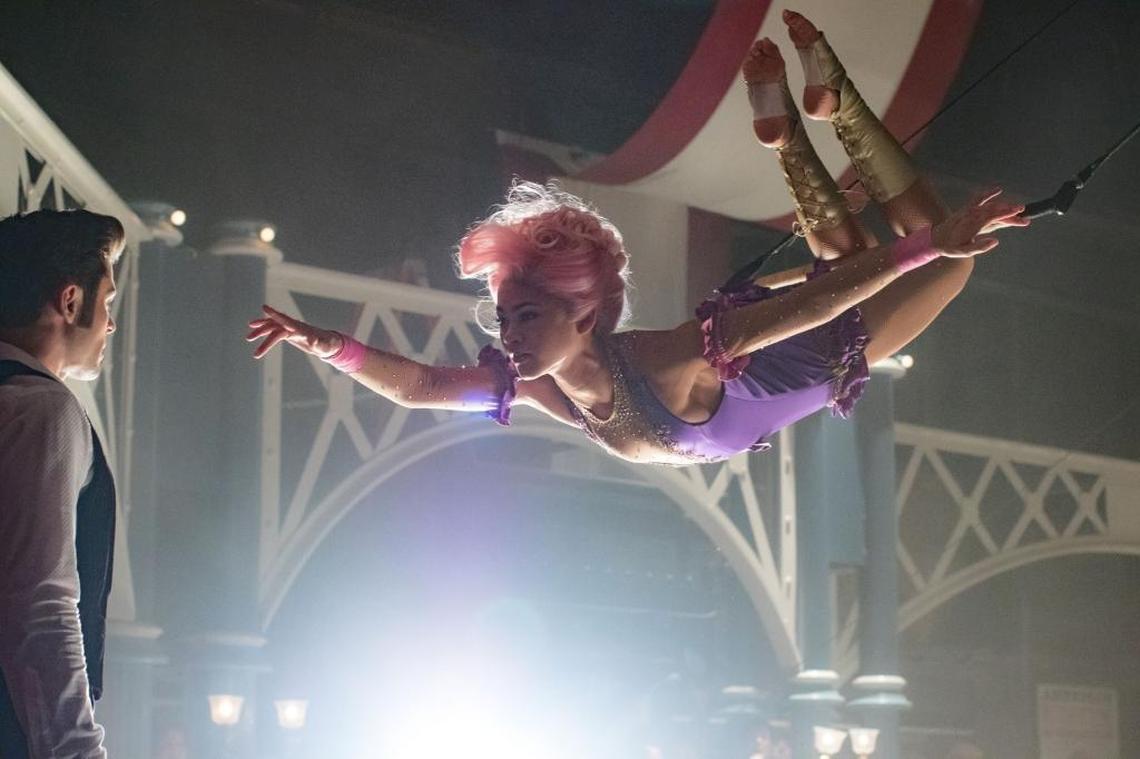 Philip (Zac Efron) is entranced by trapeze artist Anne (Zendaya) in “The Greatest Showman.”