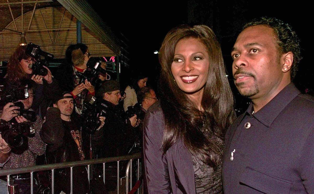 Actress Pam Grier arrives with date Kevin Evans for the premiere of Quentin Tarantino's "Jackie Brown" in Los Angeles in 1997. Grier will be honored Saturday by the San Luis Obispo International Film Festival.