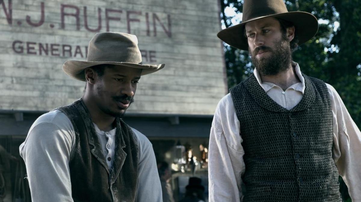 Nat Turner (Nate Parker) is hired out as a preacher by his owner, Samuel Turner (Armie Hammer) in “The Birth of a Nation.”