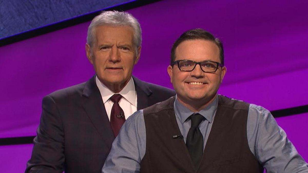 San Luis Obispo engineer Doug Groshart, right, poses with “Jeopardy!” host Alex Trebek.