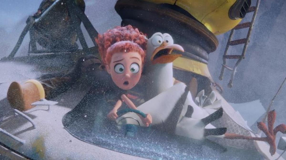 Tulip (voiced by Katie Crown) and Junior (Andy Samberg) make a daring flight in a scene from “Storks.”