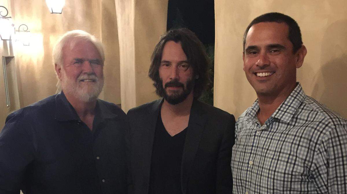 Curt Dubost, left, and his son Ted Dubost, right, pose for a picture with Keanu Reeves at Dubost Vineyard & Winery in Paso Robles. "The Matrix" star shot part of his movie "Destination Wedding," at the winery in August 2017.