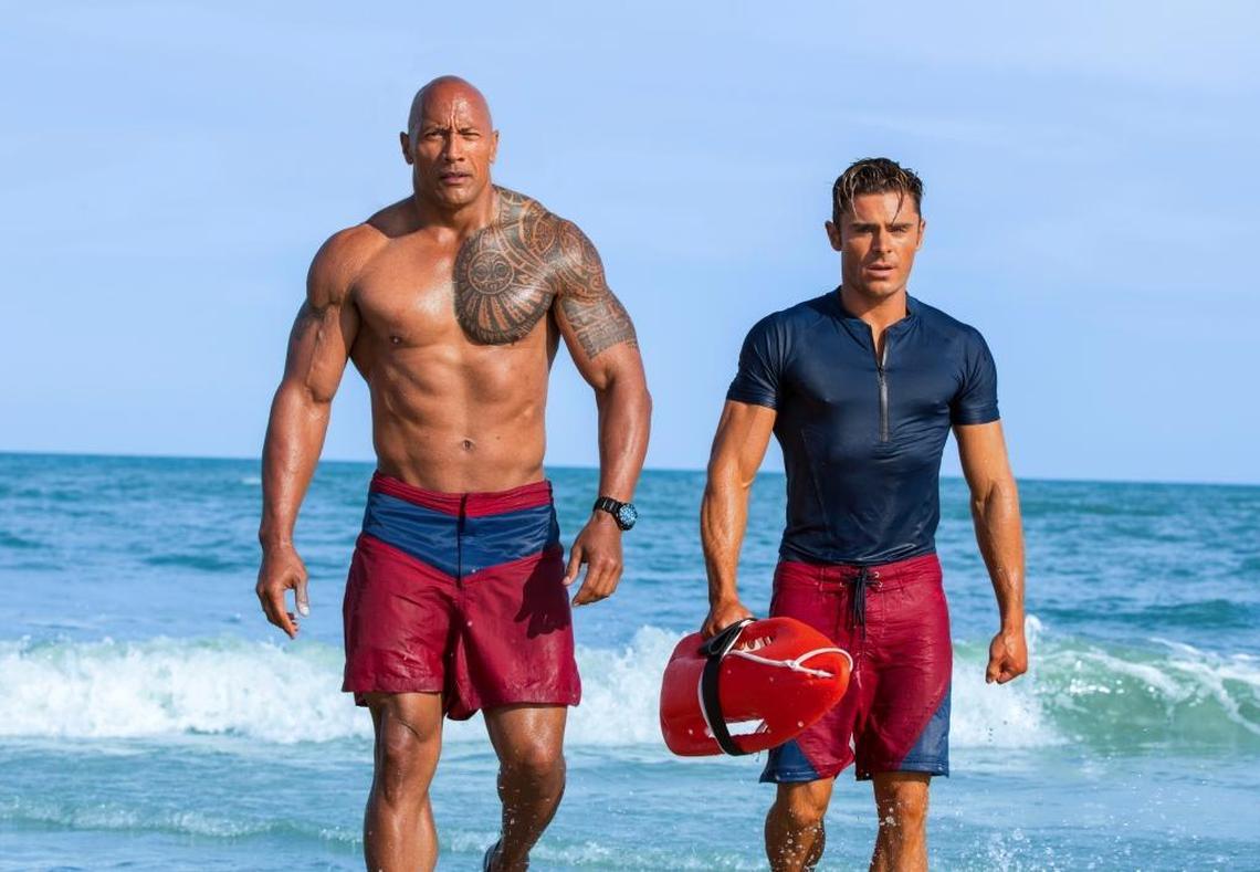 Dwayne Johnson, left, and Zac Efron appear in a scene from “Baywatch.”