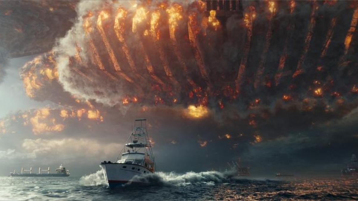 An alien ship wreaks havoc in the skies above a fleeing ship. in “Independence Day: Resurgence.”