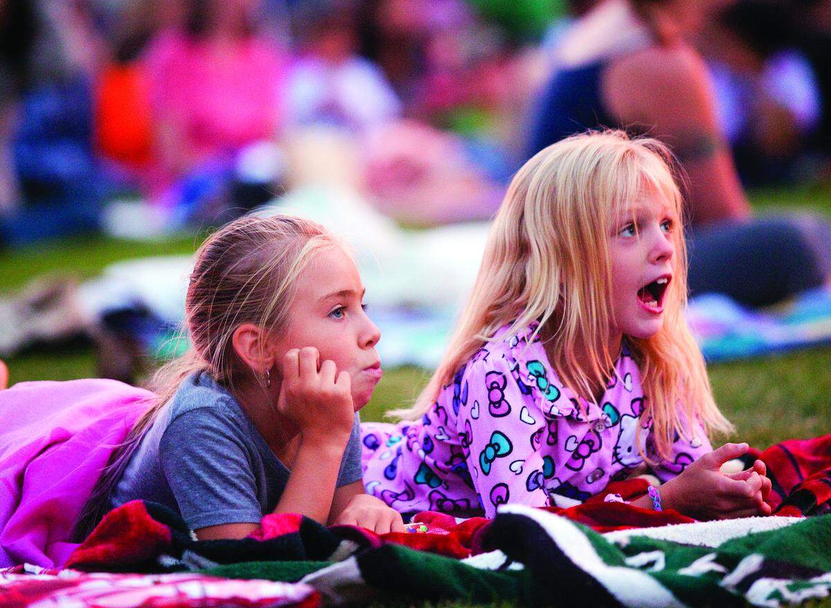 Ashley Flowers, 8 of Templeton and Tamlynn Lopez, 8 of Paso Robles, watch "The Lego Movie" in the Sunken Gardens in downtown Atascadero in 2014. The Movies in the Gardens screening series returns Aug. 4, 2018.
