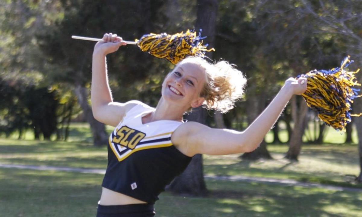 Tribune reporter Lindsey Holden shows some school spirit in this cheerleader outfit.