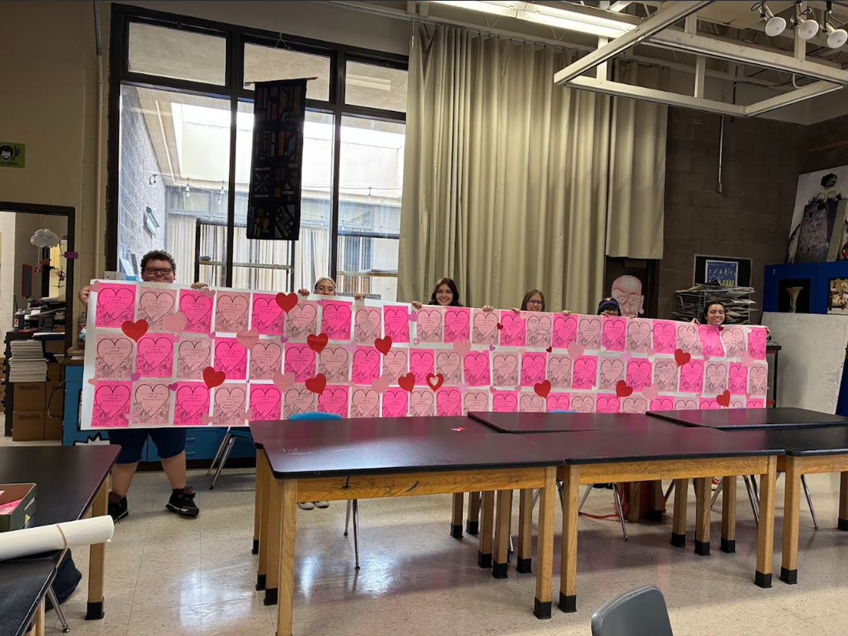 Students hold a Valentine’s Day card created by the Young Democrats club at San Luis Obispo High School for students at Roosevelt High School in Minneapolis. The project was organized in solidarity with students affected by ICE.