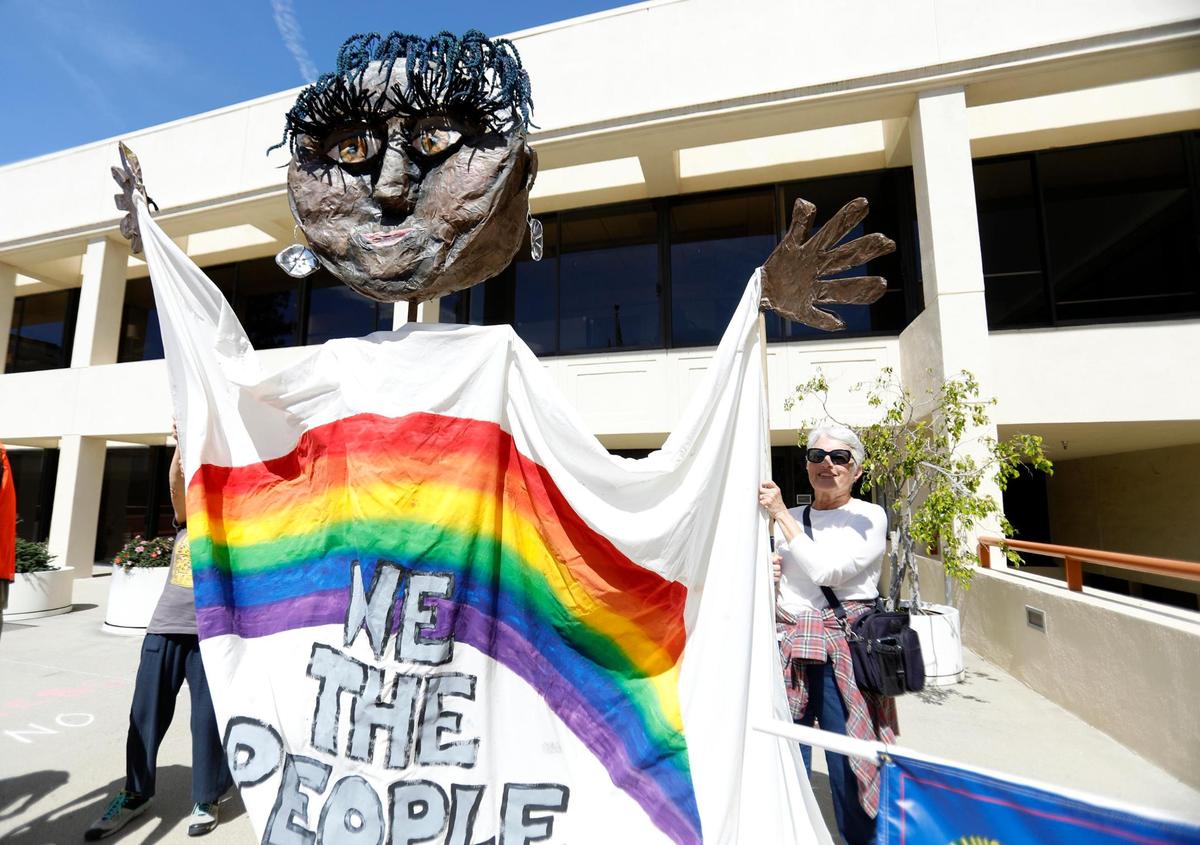 Thousands of people gather at San Luis Obispo Superior Court in California as part of the “Hands Off!” rally to protest President Donald Trump and his advisor Elon Musk.