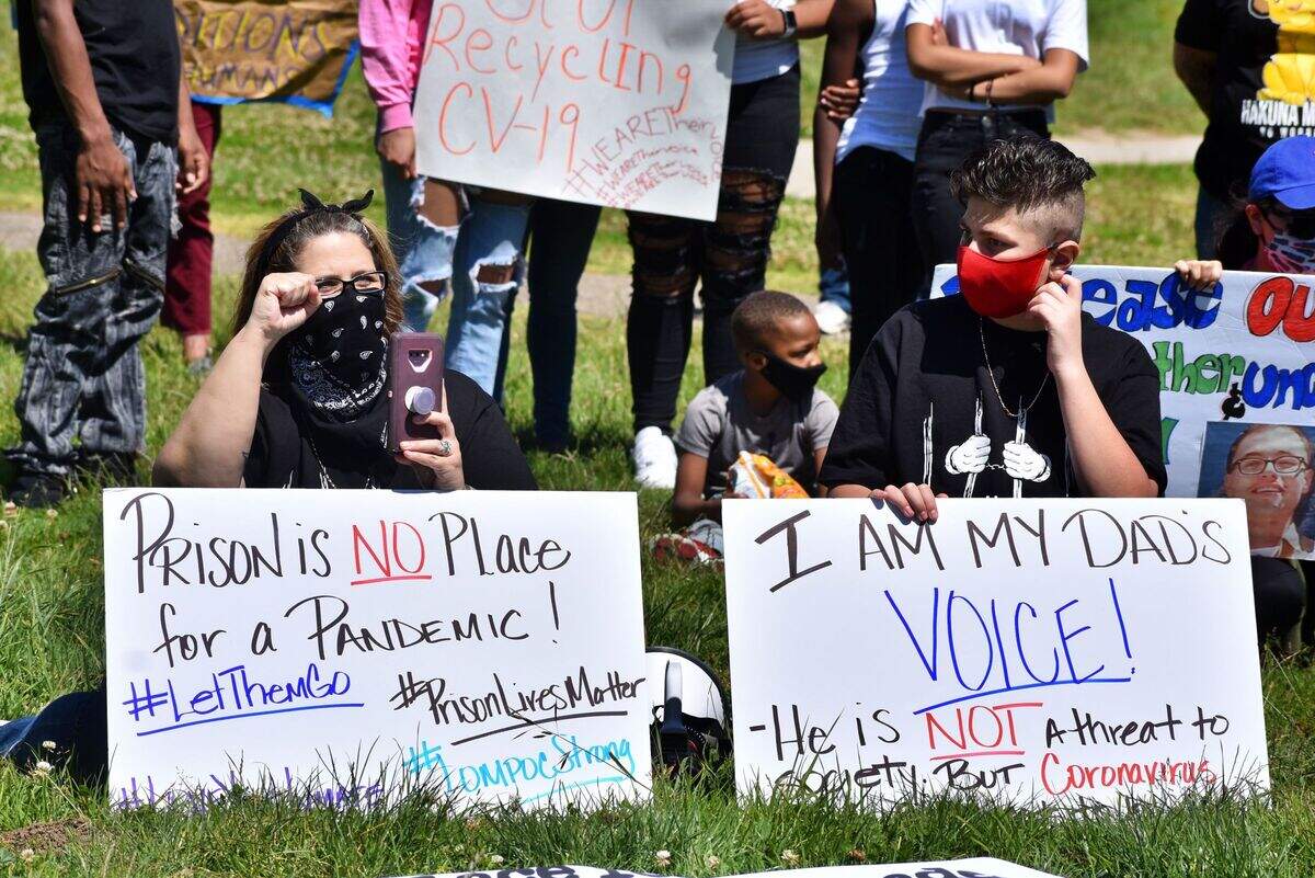 Protest organizer Chrissie Rogers, left, traveled from San Bernardino County for Sunday’s demonstration at the Lompoc federal prison complex.