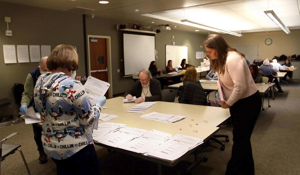 Darcia Stebbens of San Miguel, who requested the recount in the District 2 supervisor race, looks over ballots being sorted in an auxiliary room at the Katcho Achadjian Government Center on Tuesday, Dec. 20, 2022.