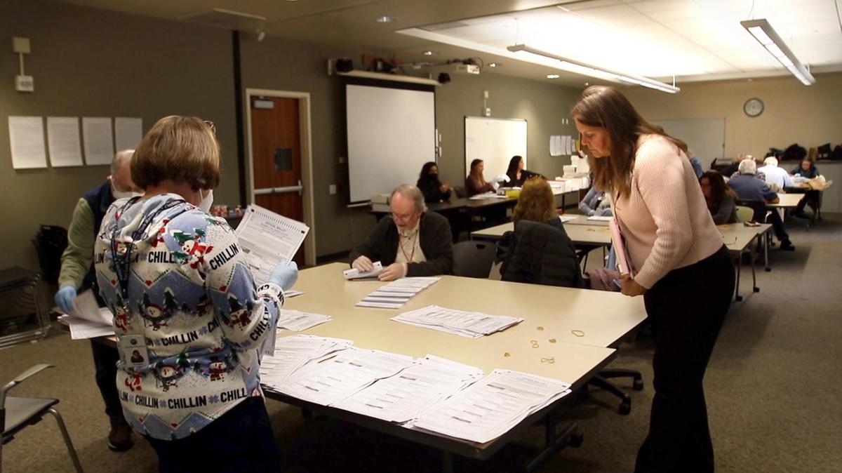 Darcia Stebbens of San Miguel, who requested the recount in the District 2 supervisor race, looks over ballots being sorted in an auxiliary room at the Katcho Achadjian Government Center on Tuesday, Dec. 20, 2022.