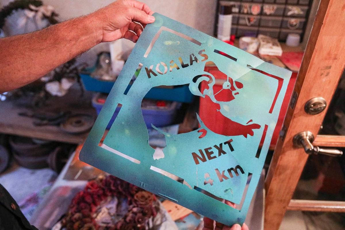 Bill Jodry holds a stencil for artwork created by his son Thomas, who died at the age of 21 in a fall from a San Luis Obispo parking structure in 2019.