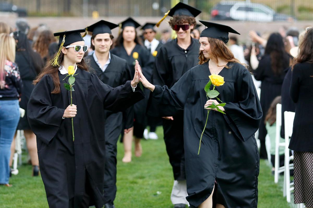 Students formed two lines and gave each other high-fives and fist bumps when they parted. San Luis Obispo High School celebrated its 389 graduating seniors in a ceremony at Holt Stadium on Friday evening, June 9, 2023.