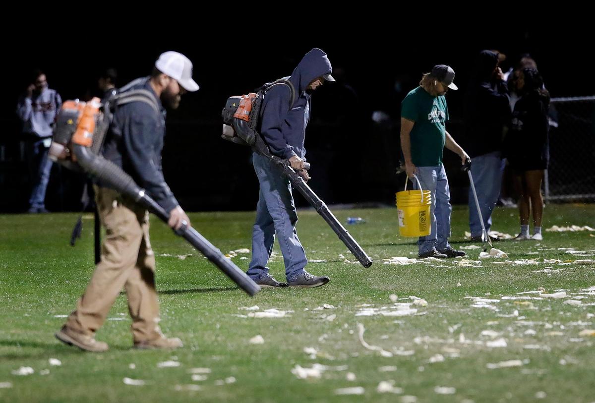 Workers use leafblowers to clear the field of tortillas thrown during the Blue-Green Rivalry men’s soccer game between Cal Poly and UCSB on Oct. 16, 2021, at Alex G. Spanos Stadium. After two overtime periods, the game ended in 0-0 draw.