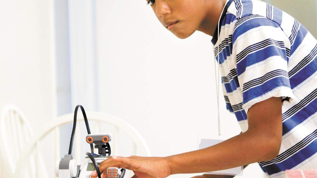 C.J. Osiris, 11, prepares to launch his robot into a maze during
a Lego robotics camp at the Central Coast Exploration Station in Grover Beach on Friday.