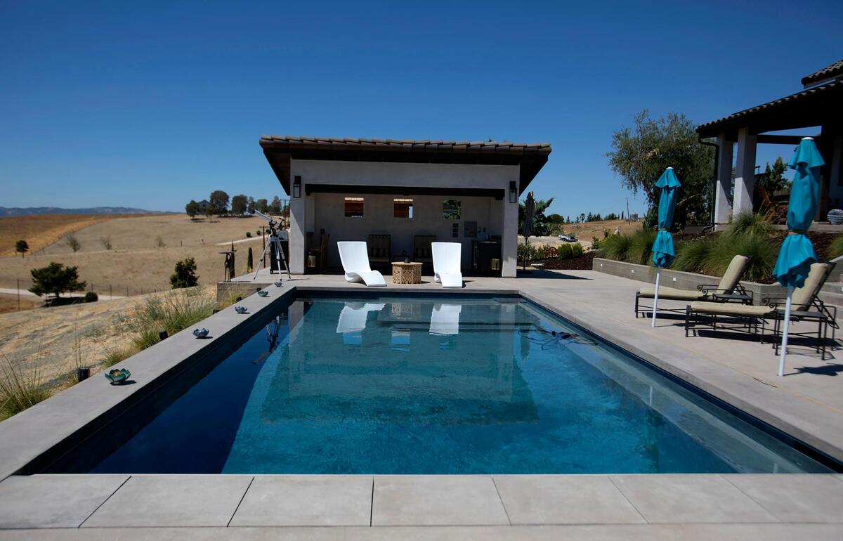 Blue Heron Pools of Paso Robles designed and installed this swimming pool at the rear of the San Miguel home of Charles Miller and Tina Gulotta-Miller.