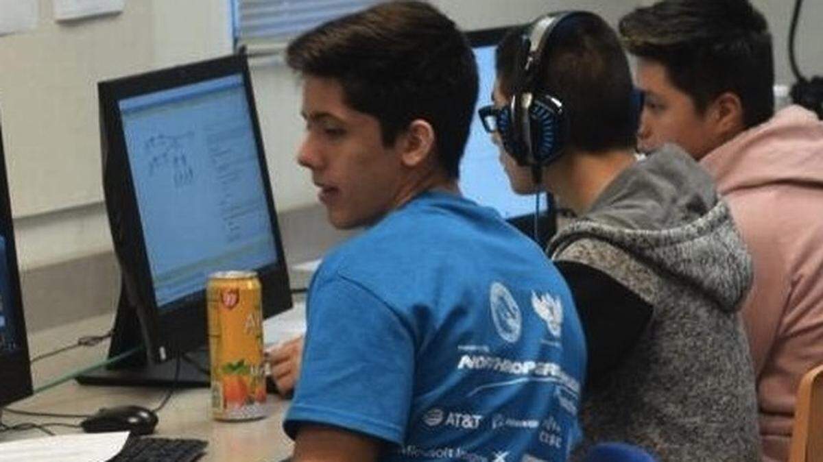 Two students from this year’s CyberPatriots team (Luis Plasencia, left, and Axel Beccerril, right) are in their second year on the team. Crecenio Atunez (middle) was also pictured in this photo from 2017.