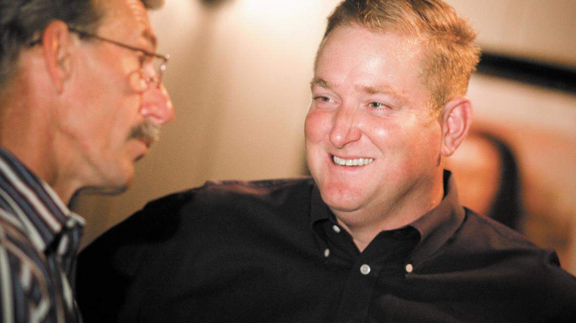 Paul Brown, right, talks with supporter John Tessler during Brown's election party at The Kilt in San Luis Obispo.