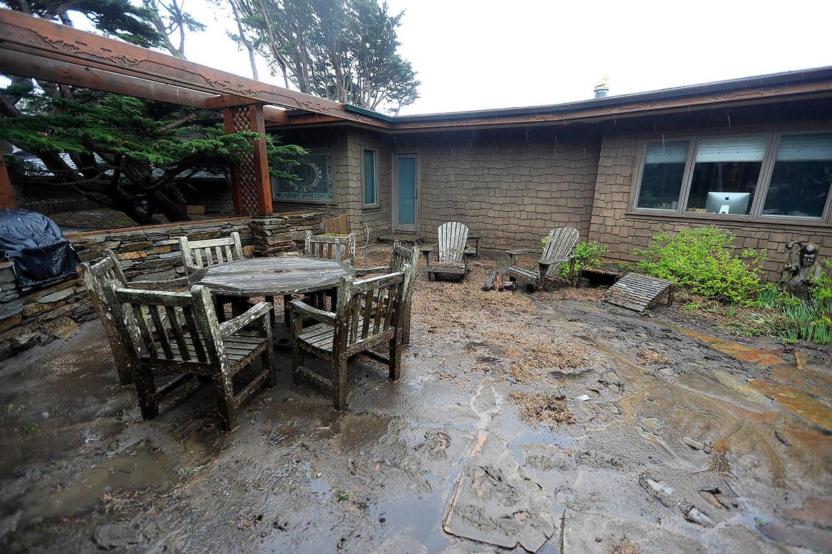 The front porch area of Diane Tappey’s home on Sherwood Lane in Cambria was inundated with water, mud, rocks and debris.