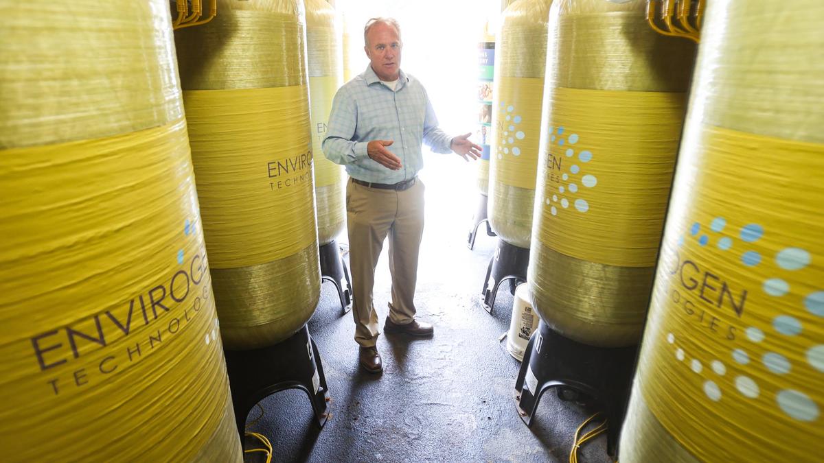 Mark Zimmer, Los Osos service area general manager for Golden State Water Co.., stands amid a system that removes nitrate from well water via ion exchange.