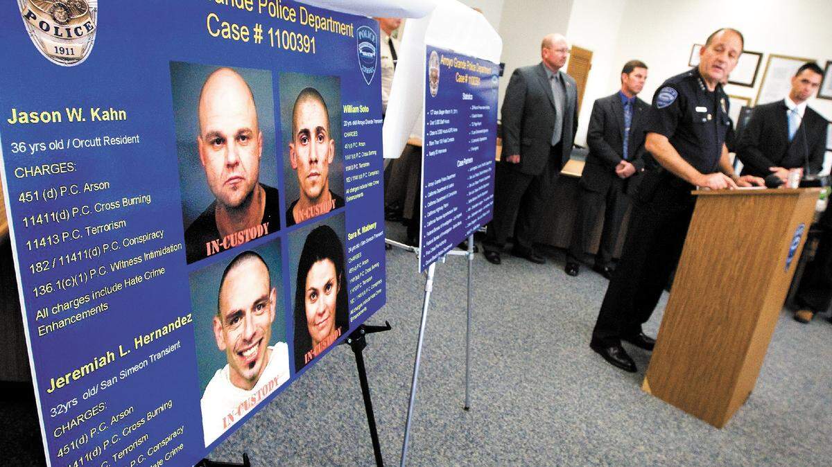 Arroyo Grande police Chief Steve Annibali, right, announced the arrest of four suspects during a news conference Friday.